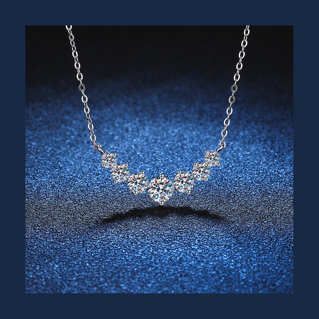 Graduated lab-created moissanite curved bar necklace