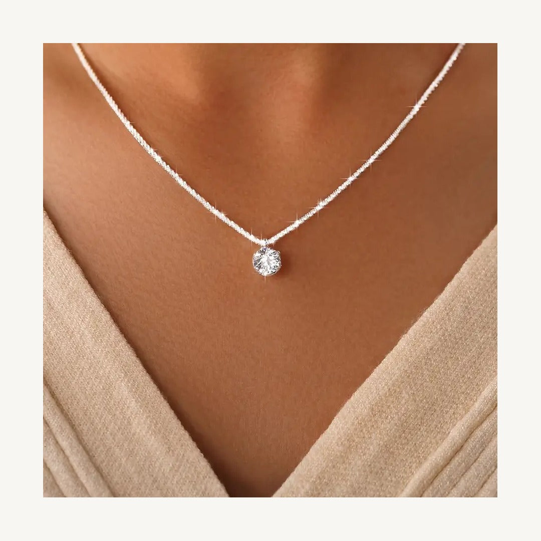 Lab-created moissanite solitaire pendant on model