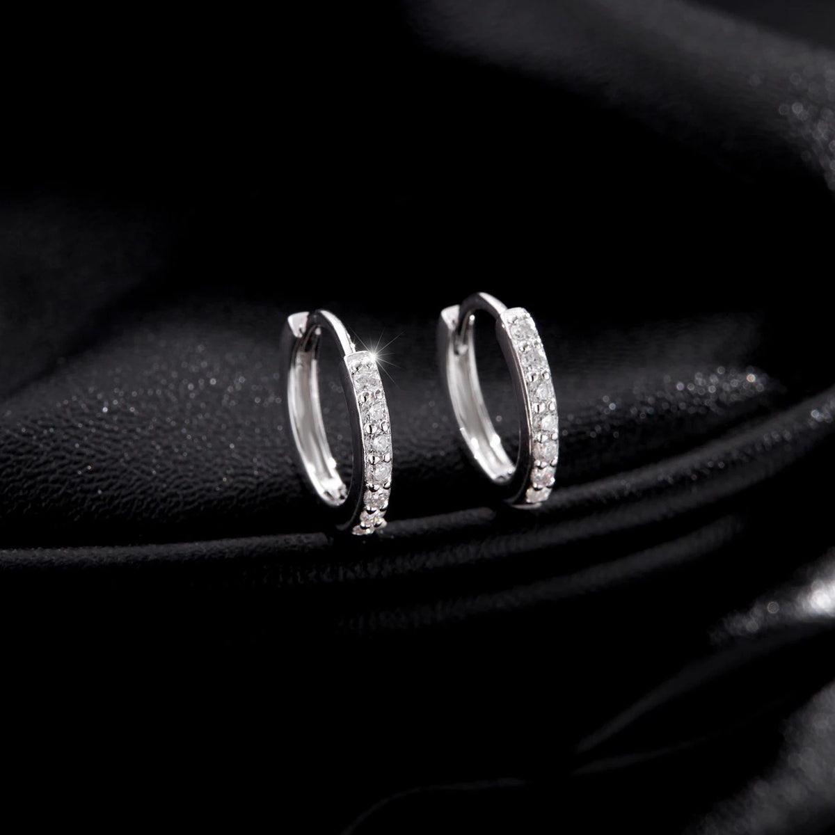 Lab-Created Moissanite Eternity Hoop Earrings, pair on black satin