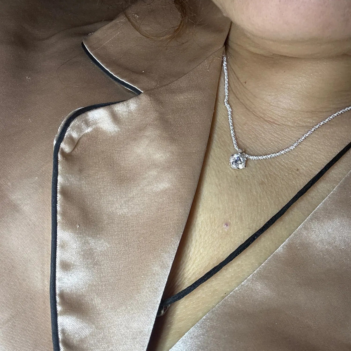 Lab-Created Moissanite Solitaire Pendant Necklace, worn with a satin blouse